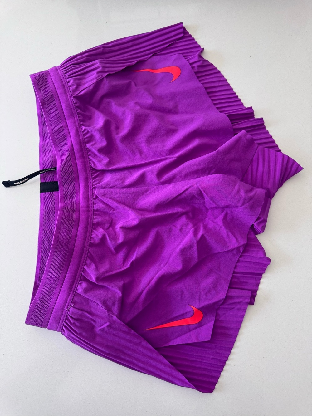 Nike Women’s Purple Athletic Shorts with Orange Swoosh